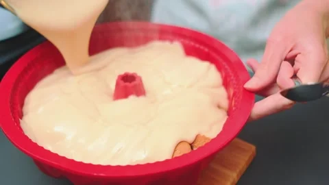 Pouring hot pudding into a baking dish Stock Footage 252408129