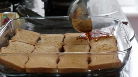 Pouring Hot Syrup Over Fried Bread Slices Slow Motion Stock Footage 331834348
