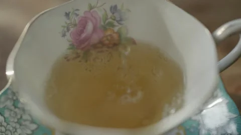 Pouring Hot Tea into Cup Cups and Teapot Teapots in Slow Motion Stock-Footage 246964778