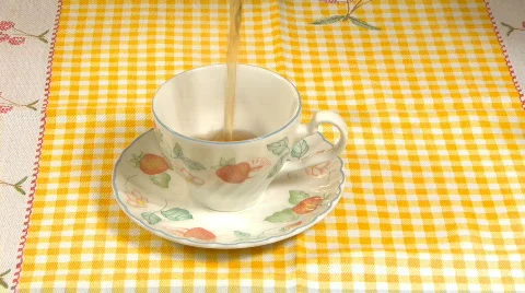 Pouring hot tea on cup Stock Footage 654137