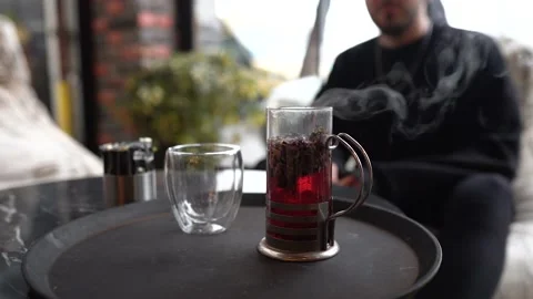 https://images.pond5.com/pouring-hot-tea-thermos-flask-footage-194380526_iconl.jpeg