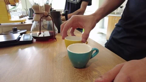 Pouring hot water into a cup, setting the stage for the artful process of Stock Footage 247534172