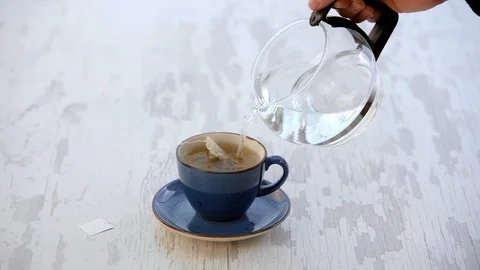 Pouring Hot Water For A Cup Of Tea - HD Stock Footage 101447600