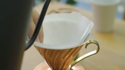 Pouring hot water over filter paper Stock Footage 148196823