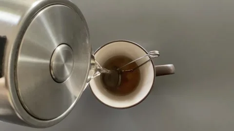 Pouring hot water slowly 스톡 동영상 342335574