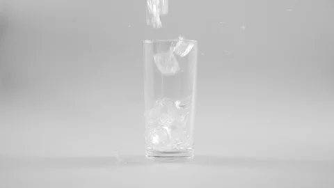 Pouring ice cube in glass Stock Footage 125120262
