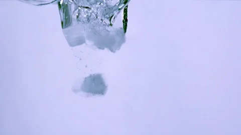 Pouring ice cubes into clear water Stock Footage 138550672