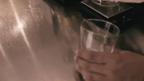 Pouring ice cubes in to a glass Stock Footage 78033638