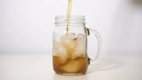 Pouring iced coffee Into cup Stock Footage 118002097