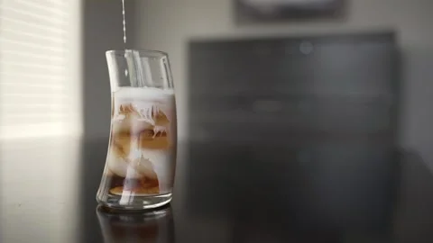 Pouring an iced coffee drink Stock Footage 146281971