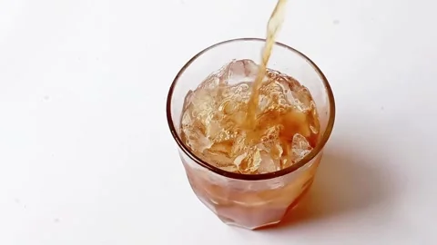 Pouring iced tea into a glass Stock Footage 287052974