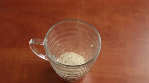 Pouring instant coffee Stock Footage 140842496