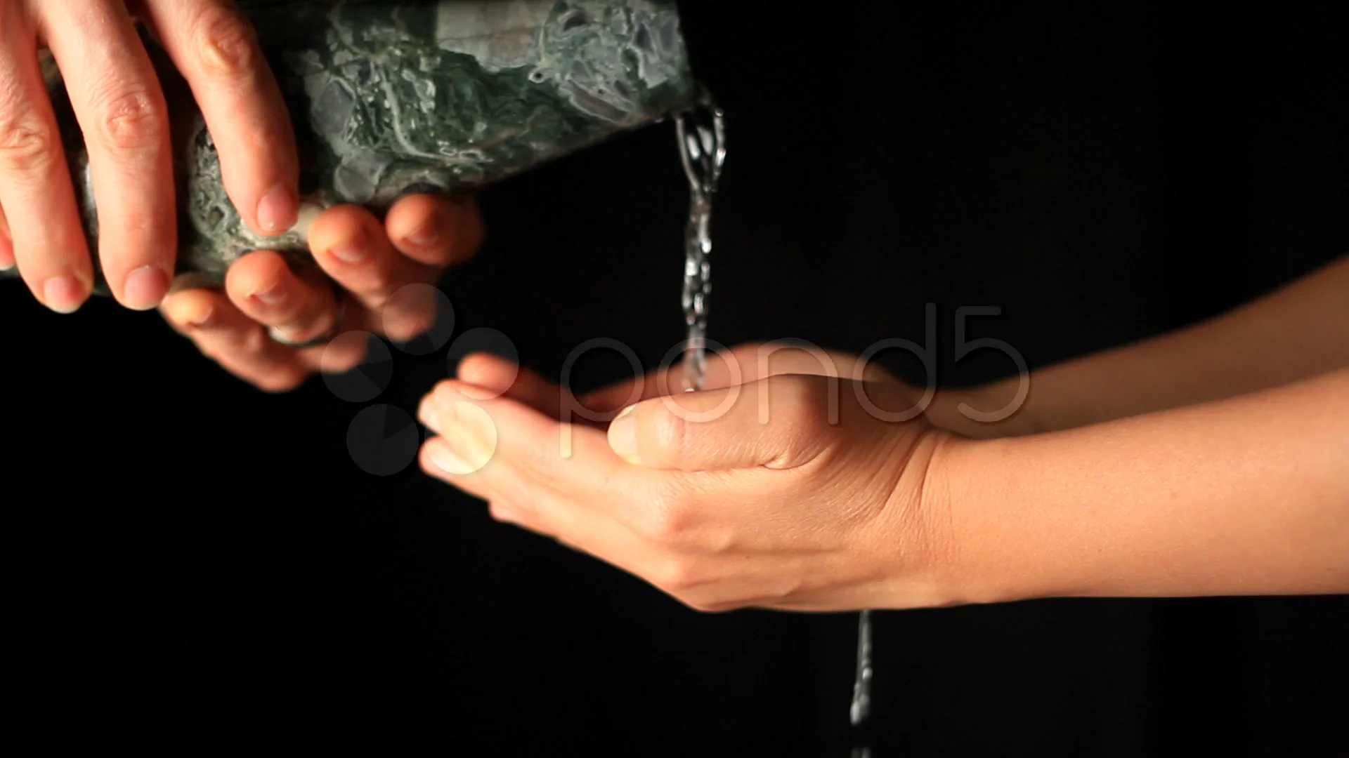 hand pouring water