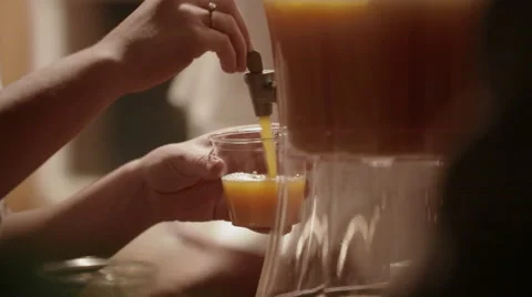 Pouring Juice at a Party Stock Footage 47772824