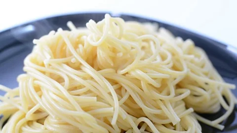 Pouring ketchup on hot spaghetti. Stock Footage 74491934