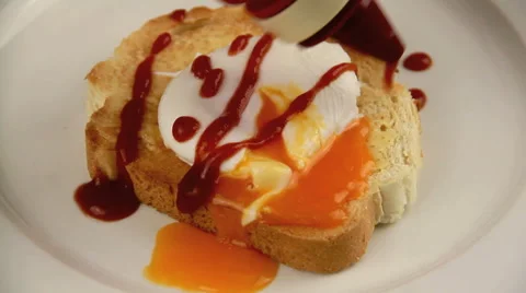 Pouring Ketchup On Poached Egg Stock Footage 67825898
