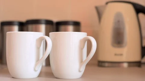 Pouring Kettle in Kitchen Stock Footage 94003262