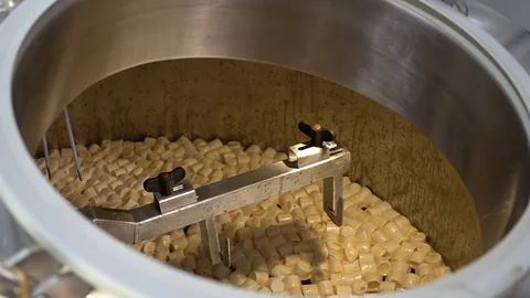 Pouring a large amount of marshmallows into a beer brewing tank. Stock Footage 128353820
