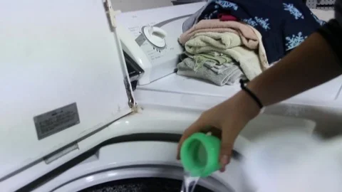 Pouring laundry detergent Stock Footage 79049707