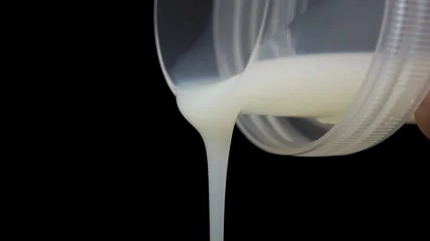 Pouring laundry detergent from a plastic cap Stock Footage 149689284