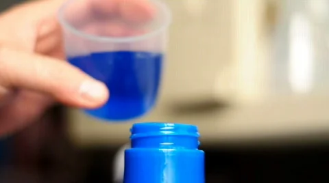 Pouring laundry detergent.  Shallow depth of field. Stock Footage 589967