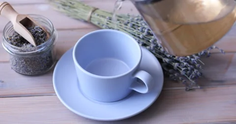 Pouring lavender tea into a cup Stock-Footage 103419020