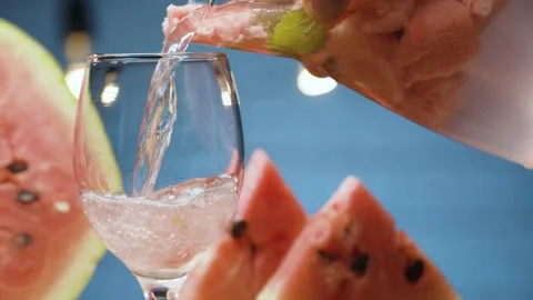 Pouring lemonade into a glass Stock Footage 142885538