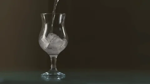 Pouring Lemonade With Ice Cubes And Bubbles In Glass Stock Footage 120987790
