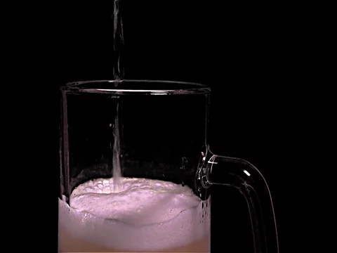 Pouring Light Beer and Foam - Close-Up, chromakey, black background Stock Footage 77568057