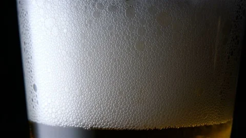 Pouring light beer into glass. Stock Footage 73599153