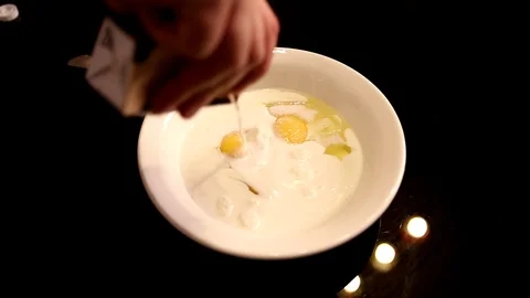 Pouring light cream to eggs Video stock 90950789