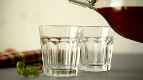 Pouring lingonberry drink Stock Footage 47821623