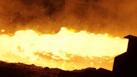 Pouring of liquid metal in open-hearth furnace. Hot steel pouring. Pouring of Stock Footage