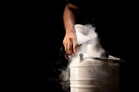 Pouring liquid nitrogen Stock Photos