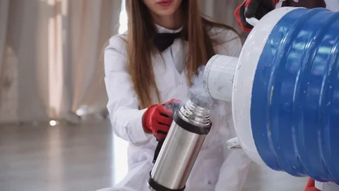 Pouring liquid nitrogen into a thermos Stock Footage 120502909
