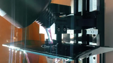 Pouring liquid resin into 3d printer vat before starting SLA printing process Stock Footage 325004866