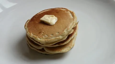 Pouring maple syrup on pancakes Stock Footage 11014802
