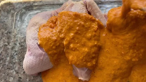 Pouring Marinade Over Raw Chicken Pieces Stock Footage 345320750