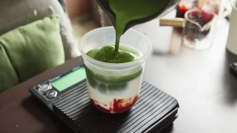 Pouring Matcha Foam Frothy Mixture on Matcha Milk Drink, Beverage Preparation Stock Footage 334037771