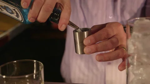 Pouring a measure of gin Stock Footage 236711536