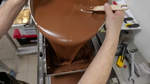 Pouring Melted Chocolate Into Processing Machine Stock Footage 331115895