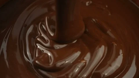 Pouring melted chocolate, slow motion Stock Footage