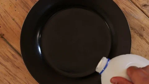 Pouring Milk and Paint Stock Footage 75607281