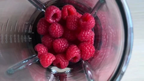 Pouring milk in blender with raspberry. super, slow motion video Stock Footage 91841643