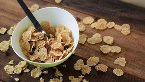 Pouring milk to breakfast cereals Stock Footage 83243586