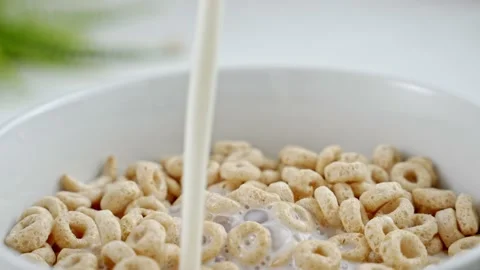 Pouring milk into Cereal. Healthy food e... | Stock Video | Pond5