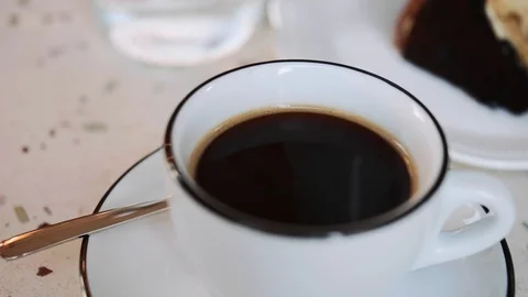 Pouring milk in coffe in cafe Video stock 123094392