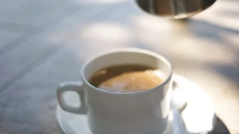 Pouring Milk into Coffee Cup Stock Footage 337955159