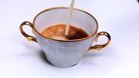 Pouring milk into coffee Stock Footage 301218278