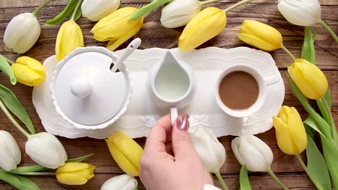 Pouring milk into a coffee top view Stock Footage 150876146